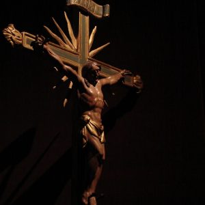 man in black shirt and pants holding sword